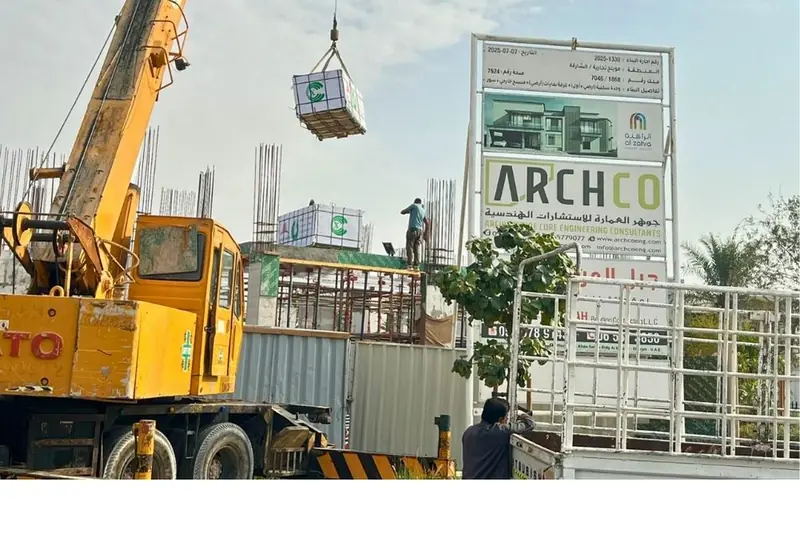 Mobile crane lifting materials at a Jabal Al Marwah villa site, Sharjah