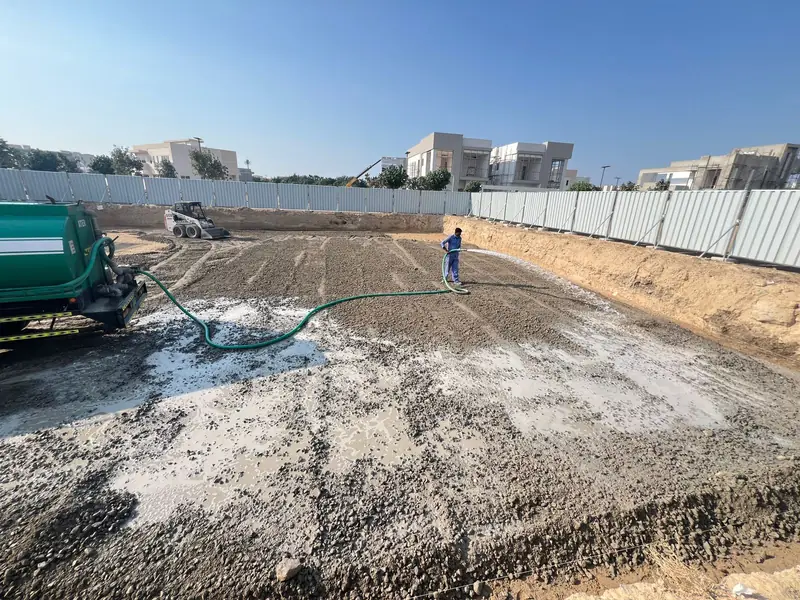 Water tanker dampening the excavated villa plot for compaction, Al Zahia Sharjah